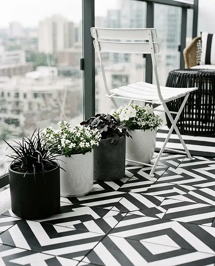 Black and White Balcony Garden Ideas 2 Matte black and white planters and deck tiles forming a monochrome balcony foundation