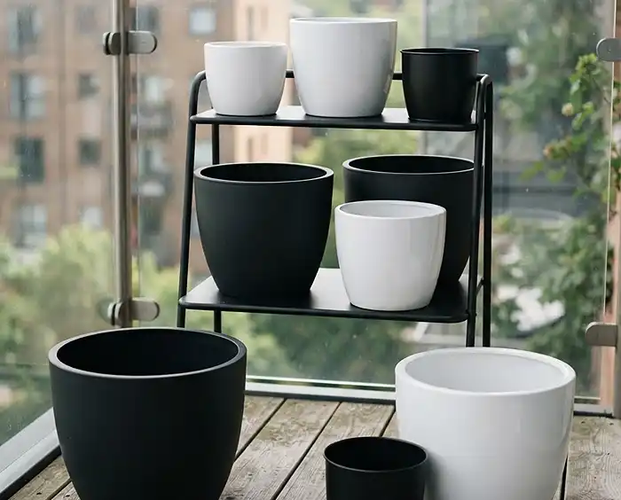Black and White Balcony Garden Ideas With Herbs 2 Black and white balcony garden ideas built on matte black and glazed white planters