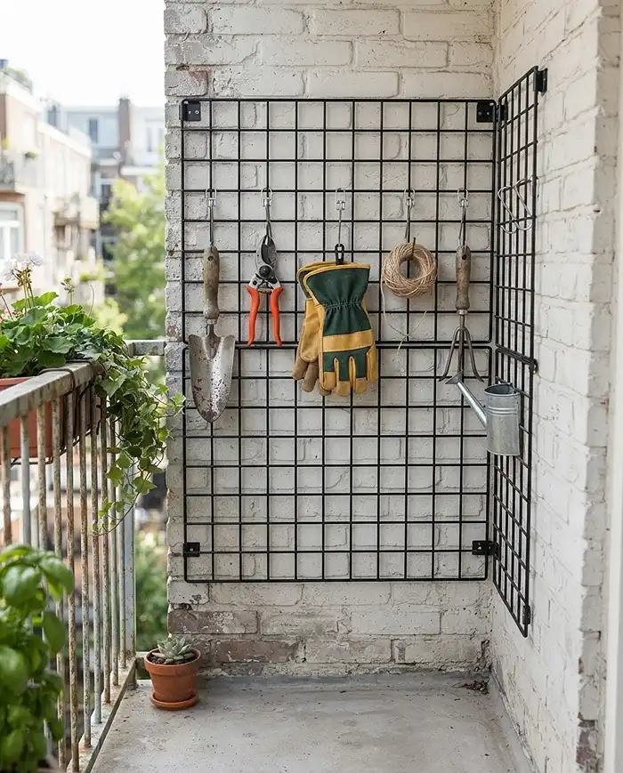 Balcony Storage Ideas for Garden Supplies 2 Vertical wall pegboard holding garden tools to save floor space on a balcony