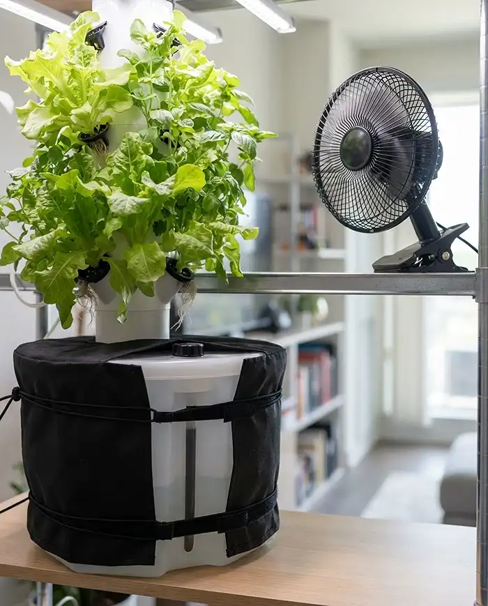 Blocking light from a reservoir with a black cover and adding a fan to stop algae and mold in an indoor system