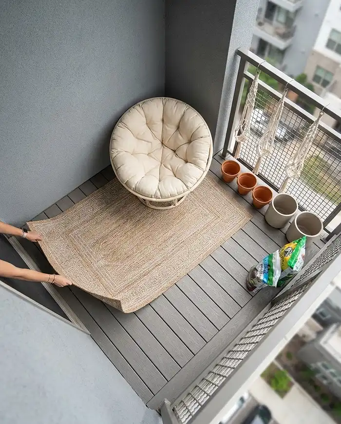 Balcony Reading Nook Ideas With Cozy Container Plants 4 Rolling out the rug and centering the chair first before placing screening plants and hanging baskets when styling the nook