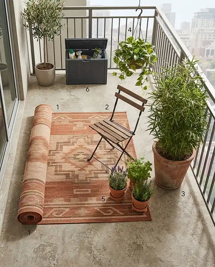 Styling a balcony nook in order from rug to chair to privacy plants to trailing baskets and herbs, following the steps